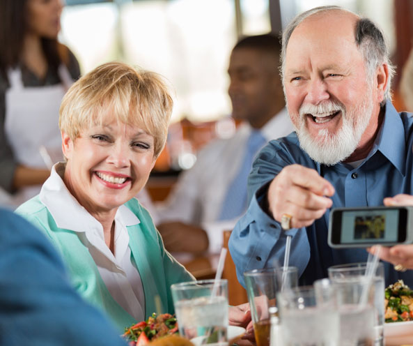 Laughing couple in community dining room